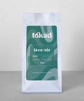 Café Lève-Tôt Tokad, sac 500g, torréfaction foncée, arômes de caramel brûlé, noisette et cerise